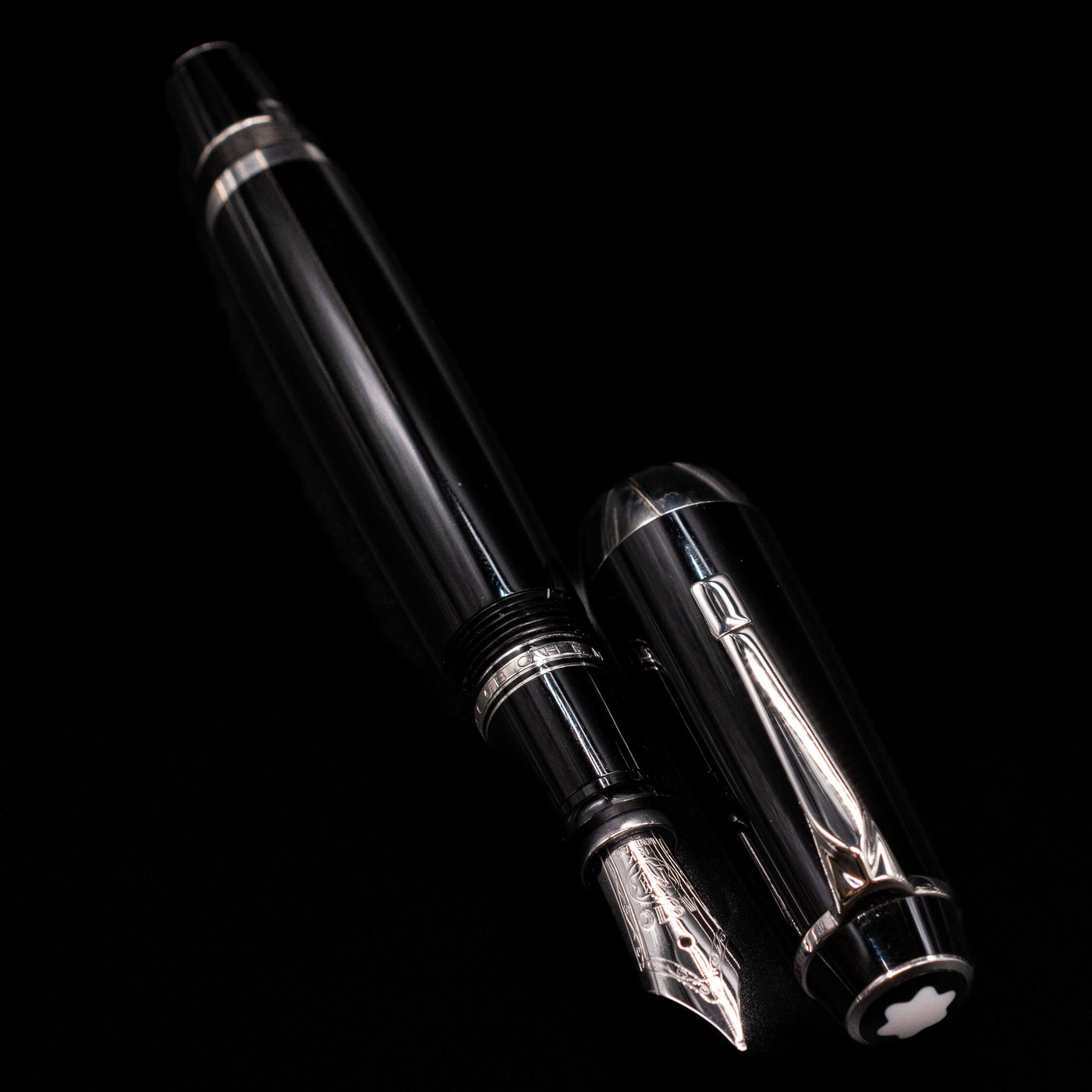 A full view of the Montblanc Boheme Jumbo Large Fountain Pen - Preowned uncapped, with its cap laying next to the pen. 