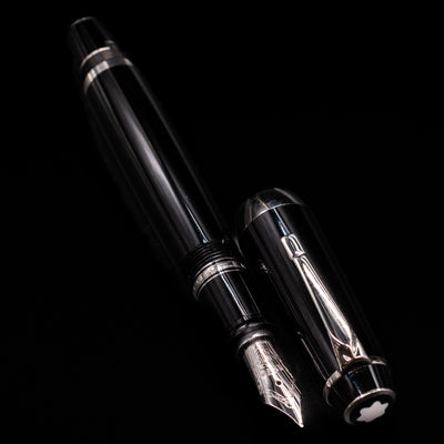 A full view of the Montblanc Boheme Jumbo Large Fountain Pen - Preowned uncapped, with its cap laying next to the pen. 