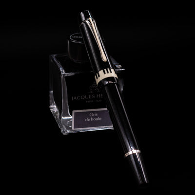 Montblanc Donation Herbert von Karajan Fountain Pen - Preowned capped, leaning against an ink bottle. 