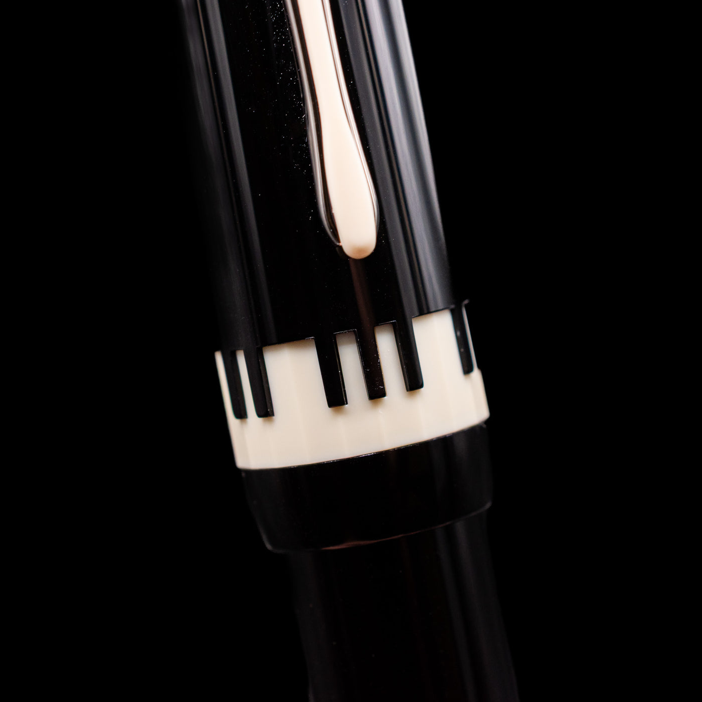 A macro shot of the piano-like detailing on the center band of the Montblanc Donation Herbert von Karajan Fountain Pen - Preowned.