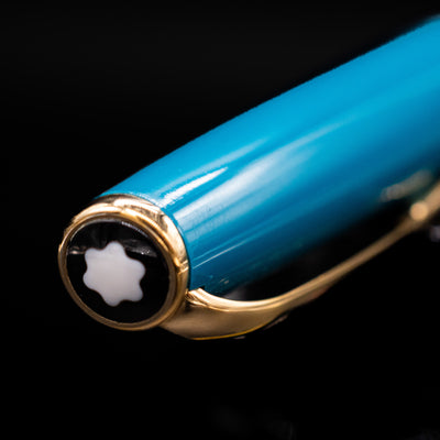 Zoomed-in view of the top of the cap with the finial on the Montblanc Generation Turquoise Fountain Pen - Preowned.