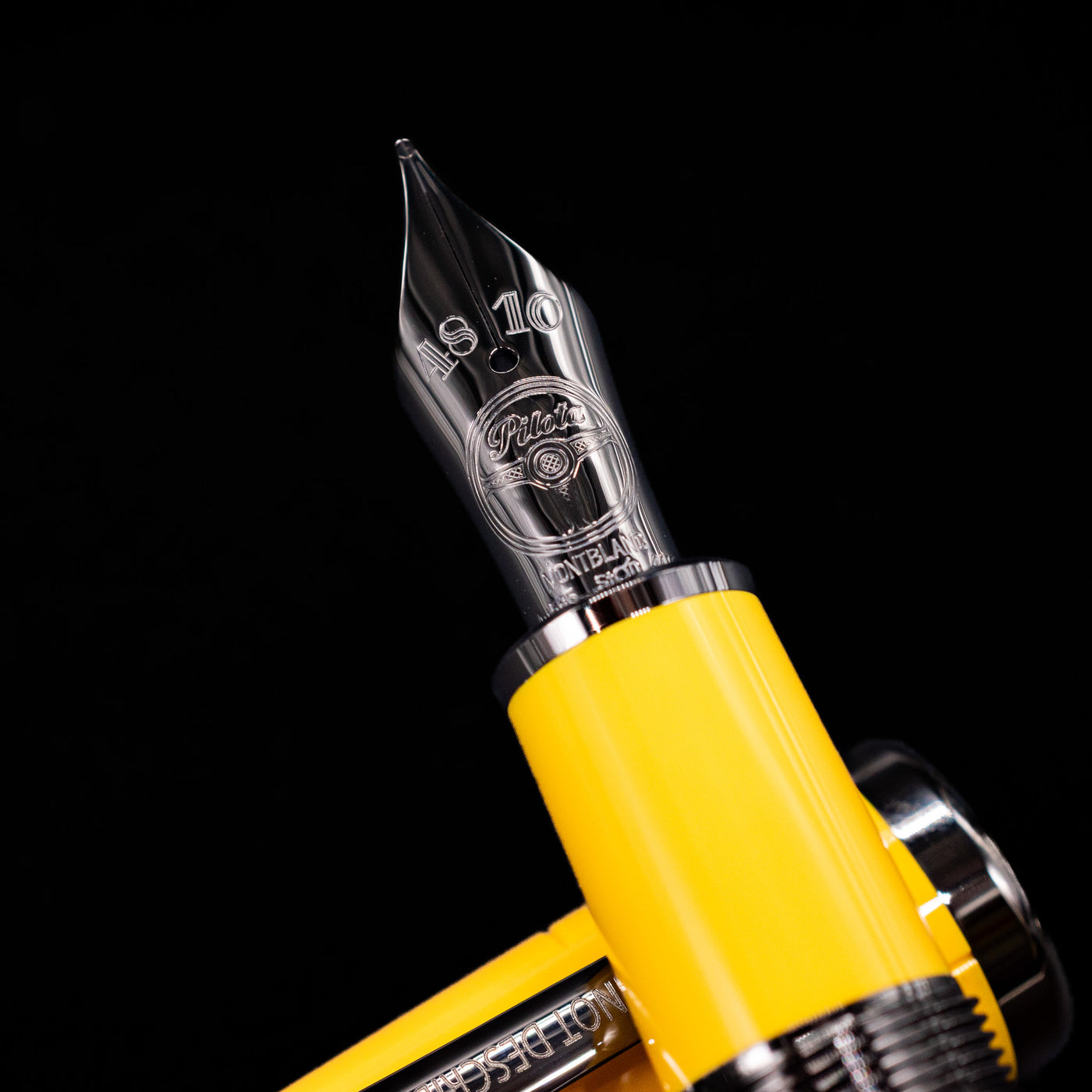 A macro shot of the nib with its intricate detailing and logo engraving for the Montblanc Great Characters Enzo Ferrari Fountain Pen - Giallo Modena.