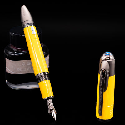 Montblanc Great Characters Enzo Ferrari Fountain Pen - Giallo Modena leaning on an ink bottle uncapped showcasing the detailing on the nib.