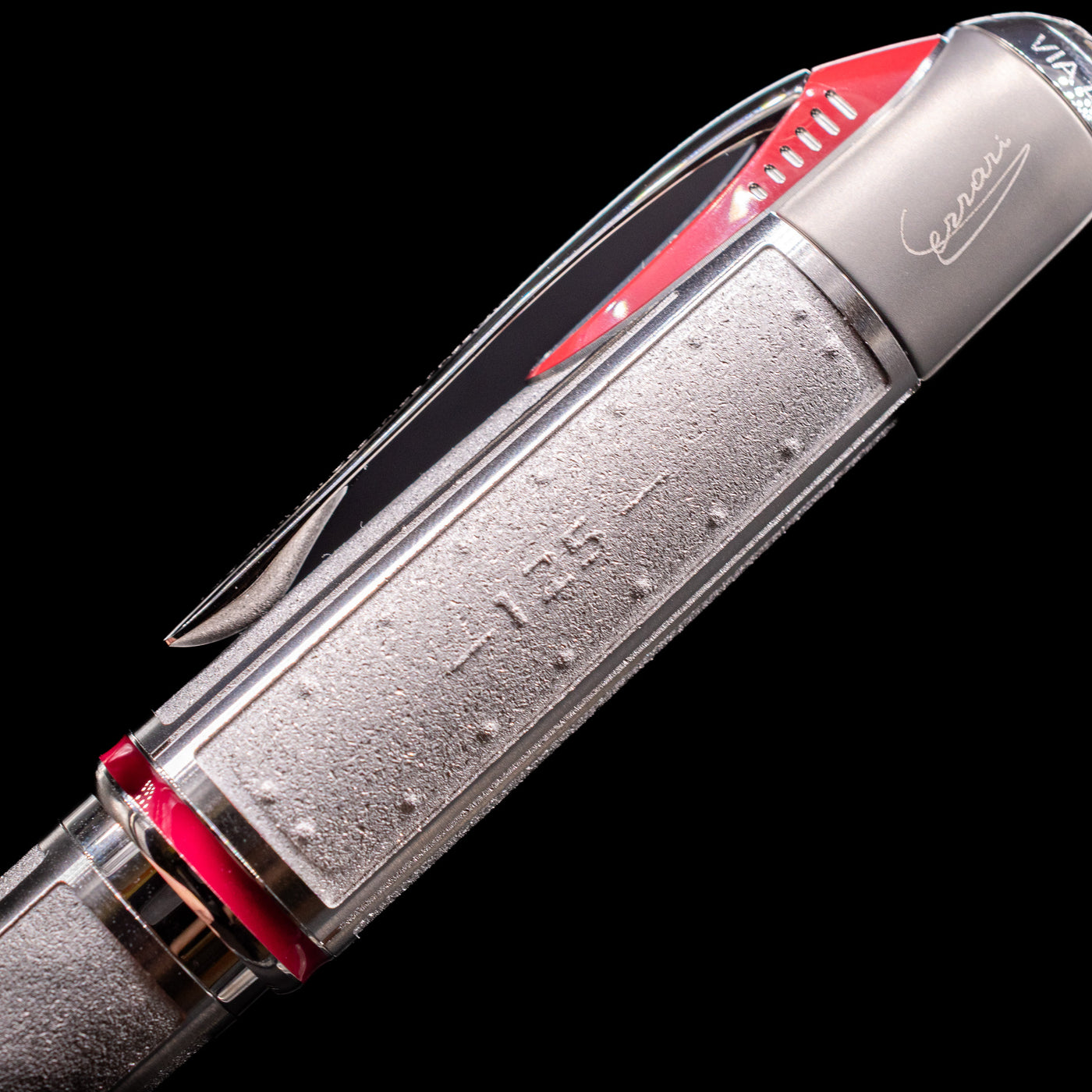 Close-up view of the side of the cap on the Montblanc Great Characters Enzo Ferrari Limited Edition 1898 Rollerball Pen - Preowned showcasing its intricate metal detailings.