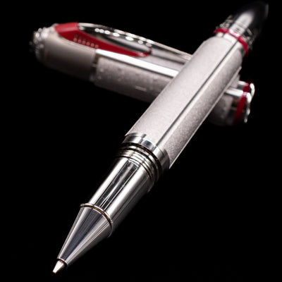 Montblanc Great Characters Enzo Ferrari Limited Edition 1898 Rollerball Pen - Preowned laying across its own cap, crossed, with a focus on the tip.
