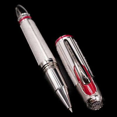  A full view of the Montblanc Great Characters Enzo Ferrari Limited Edition 1898 Rollerball Pen - Preowned uncapped, with its cap laying next to the pen.  