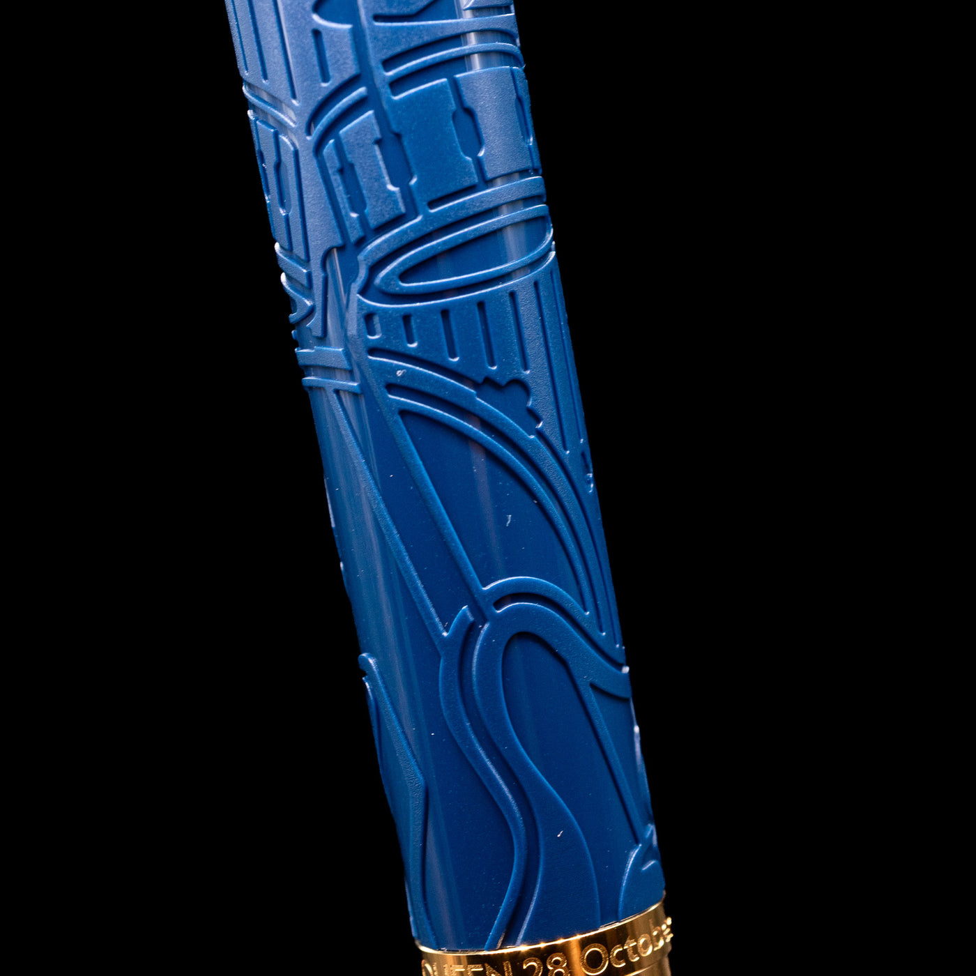 A detail shot of the Montblanc Great Characters Homage to Queen Fountain Pen showcasing the guitar and drums.
