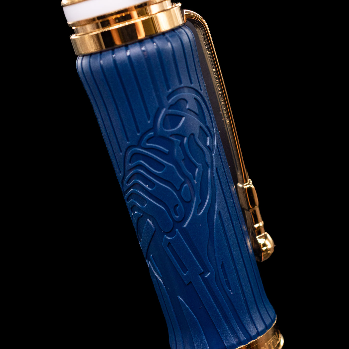A detail shot of the Montblanc Great Characters Homage to Queen Fountain Pen showcasing a hand holding a microphone.