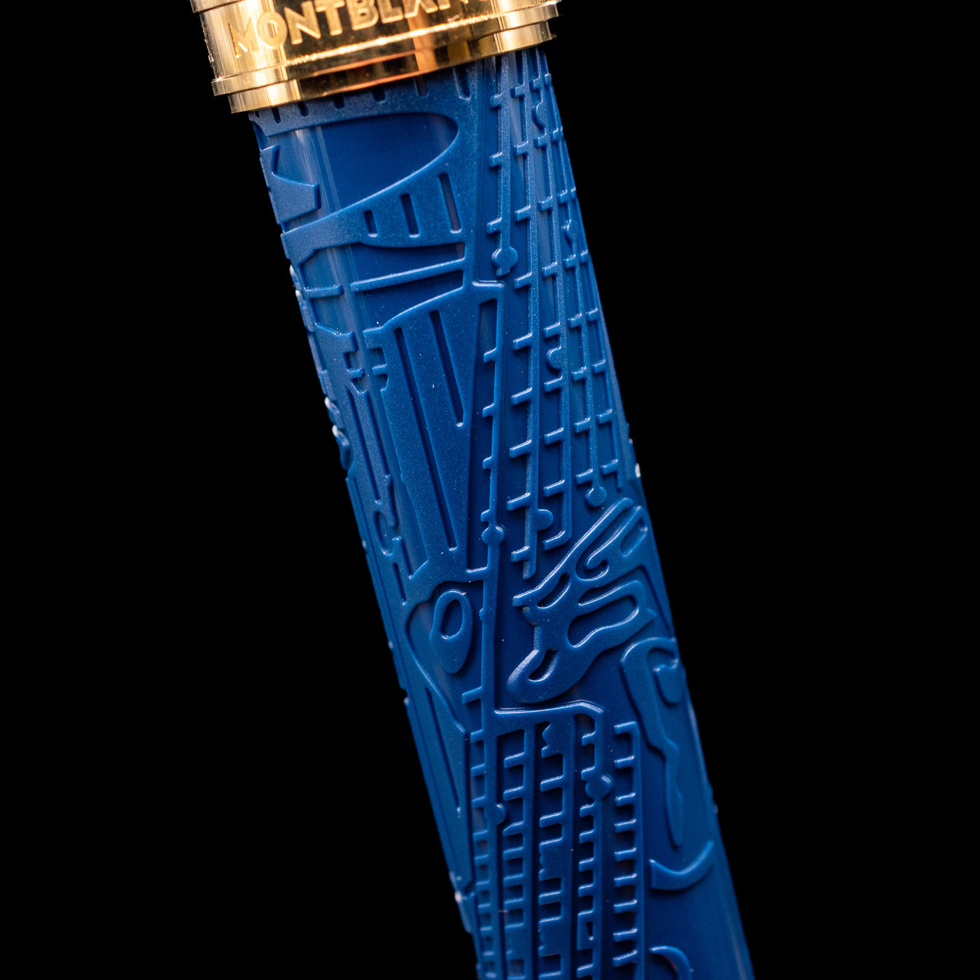 A detail shot of the Montblanc Great Characters Homage to Queen Fountain Pen showcasing the the strings of a guitar.
