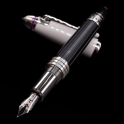 Montblanc Great Characters Jimi Hendrix Fountain Pen laying across its own cap, crossed, with a focus on the nib.