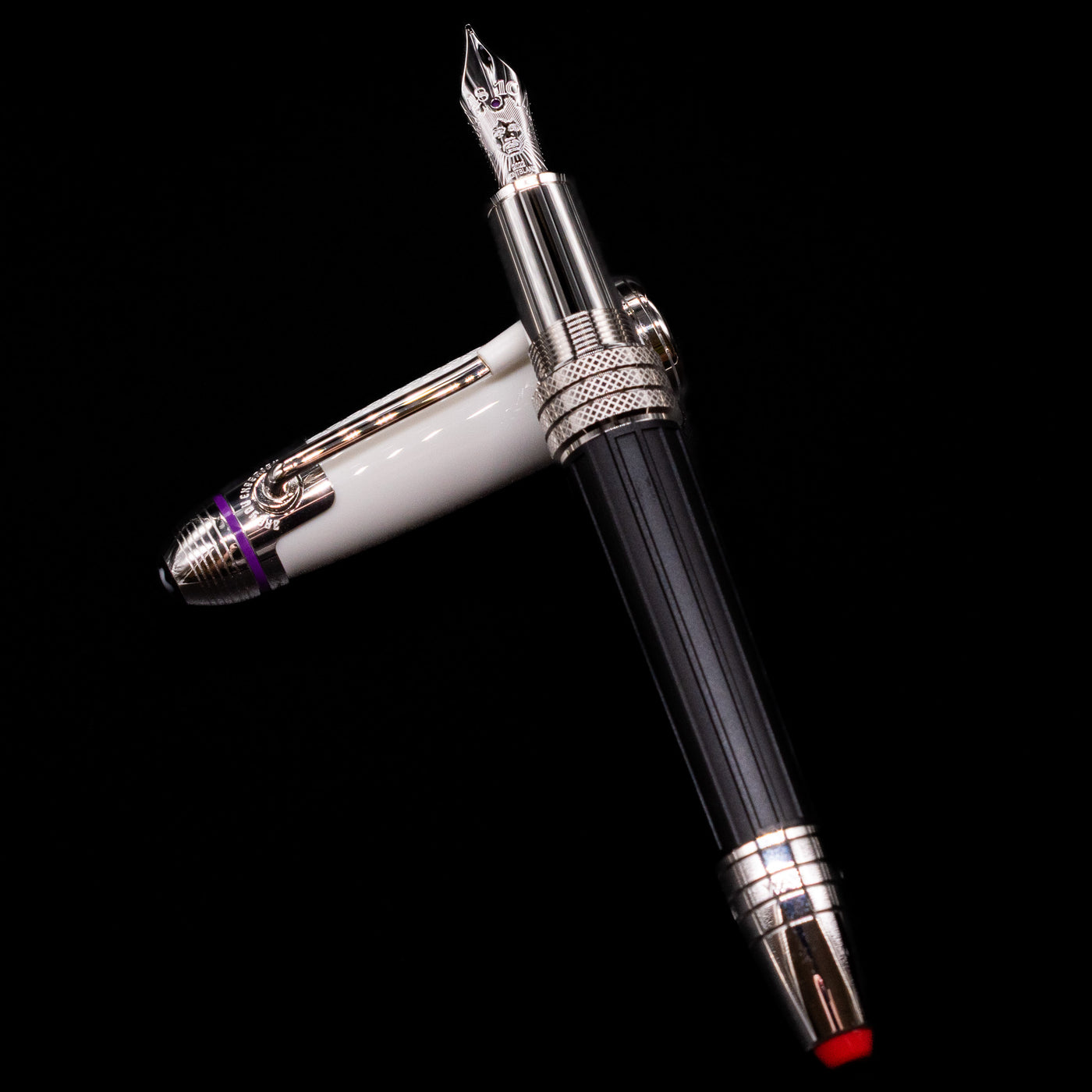 Montblanc Great Characters Jimi Hendrix Fountain Pen laying on top of its cap in a crossed position showing full view of the entire uncapped pen.