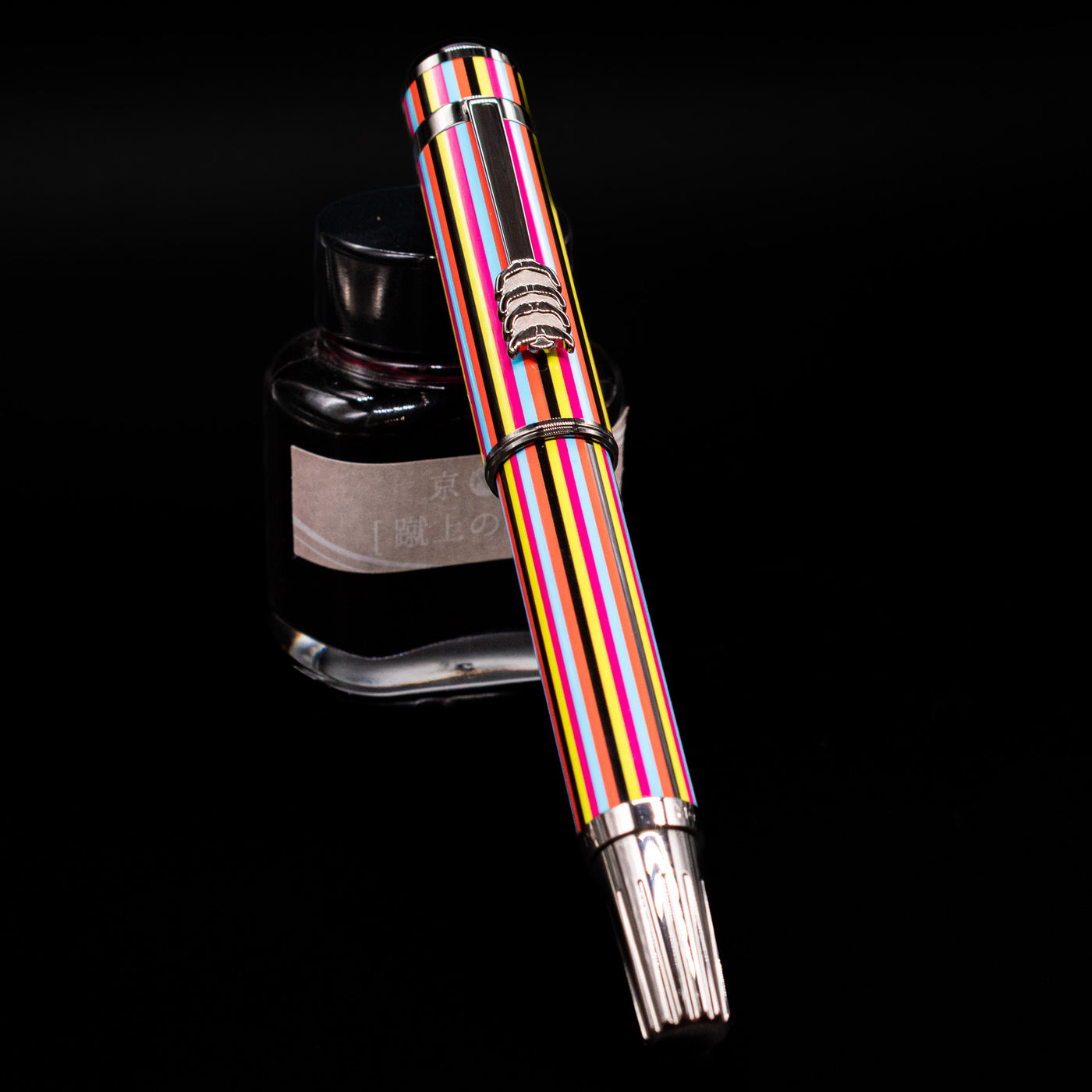 Montblanc Great Characters The Beatles Special Edition Fountain Pen - Preowned capped, leaning against an ink bottle. 