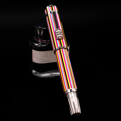 Montblanc Great Characters The Beatles Special Edition Fountain Pen - Preowned capped, leaning against an ink bottle. 