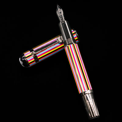 Montblanc Great Characters The Beatles Special Edition Fountain Pen - Preowned laying on top of its cap in a crossed position showing full view of the entire uncapped pen.