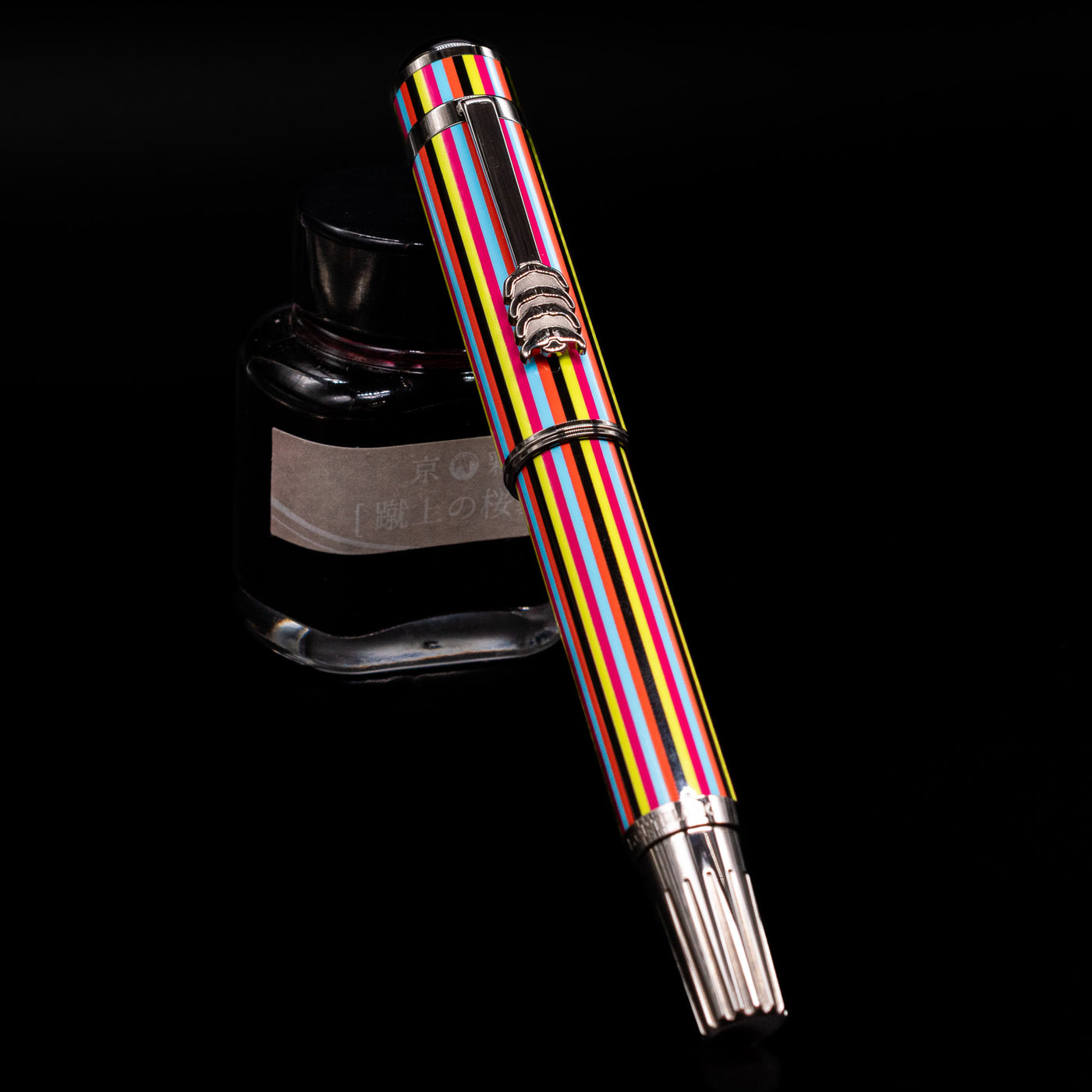 Montblanc Great Characters The Beatles Special Edition Rollerball Pen - Preowned capped, leaning against an ink bottle. 