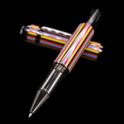 Montblanc Great Characters The Beatles Special Edition Rollerball Pen - Preowned laying across its own cap, crossed, with a focus on the tip.