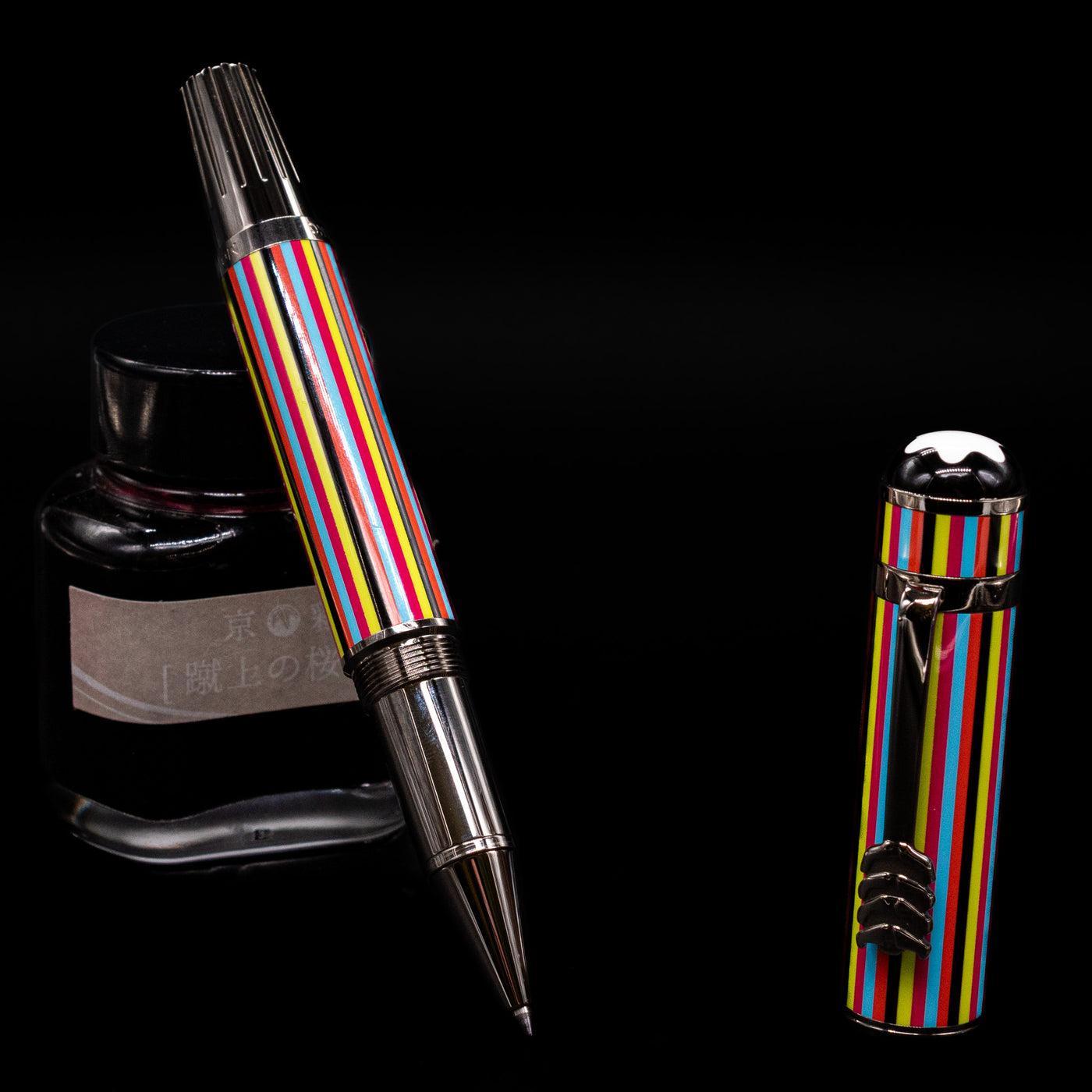 Montblanc Great Characters The Beatles Special Edition Rollerball Pen - Preowned leaning on an ink bottle uncapped showcasing the detailing on the tip.