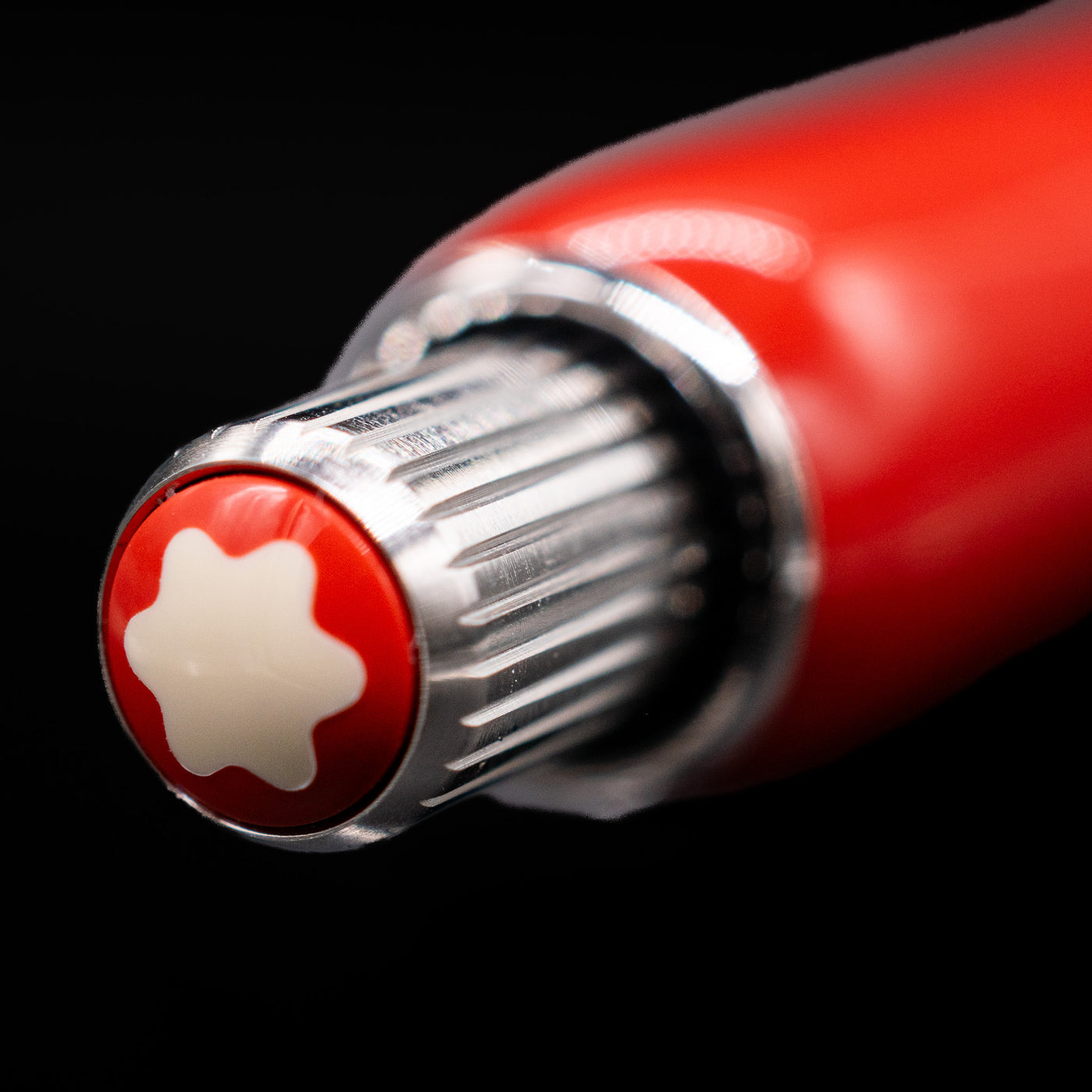 Zoomed-in view of the top of the cap with the finial on the Montblanc Heritage Baby Ballpoint Pen - Coral.