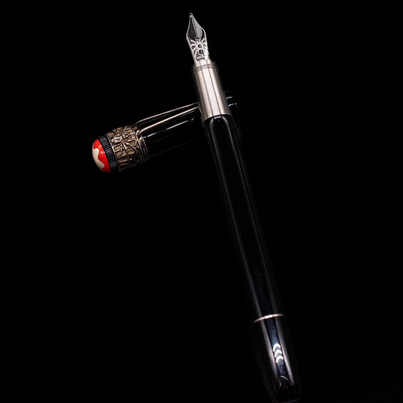 Montblanc Heritage Collection Metamorphosis Fountain Pen - Preowned laying on top of its cap in a crossed position showing full view of the entire uncapped pen.