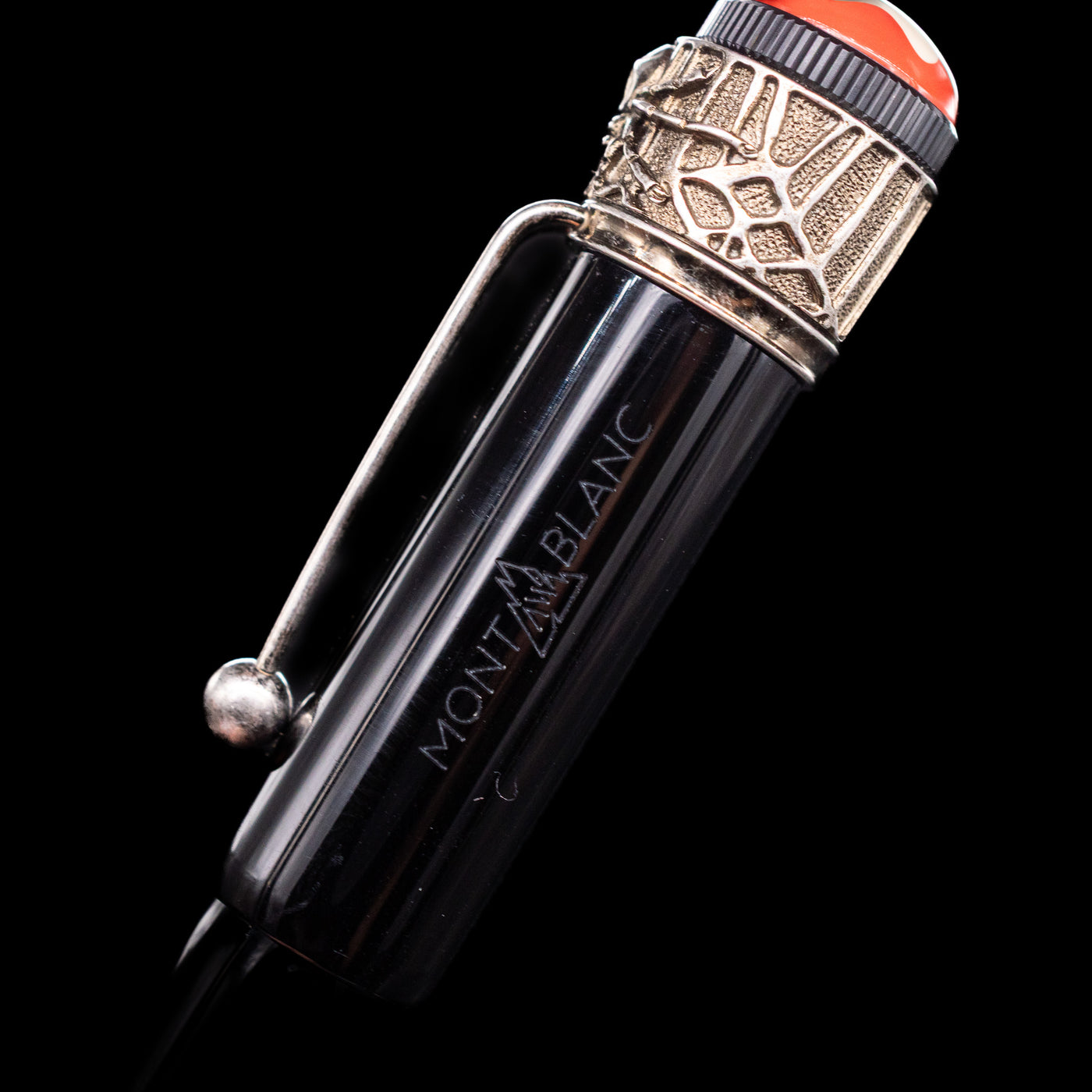 A close-up view of the Montblanc logo on the side of the cap on the Montblanc Heritage Collection Metamorphosis Rollerball Pen - Preowned.