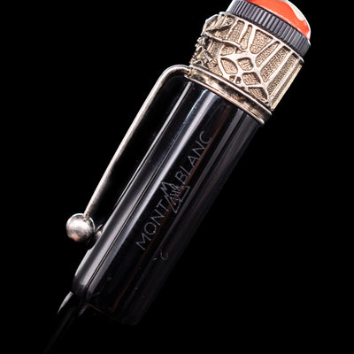 A close-up view of the Montblanc logo on the side of the cap on the Montblanc Heritage Collection Metamorphosis Rollerball Pen - Preowned.