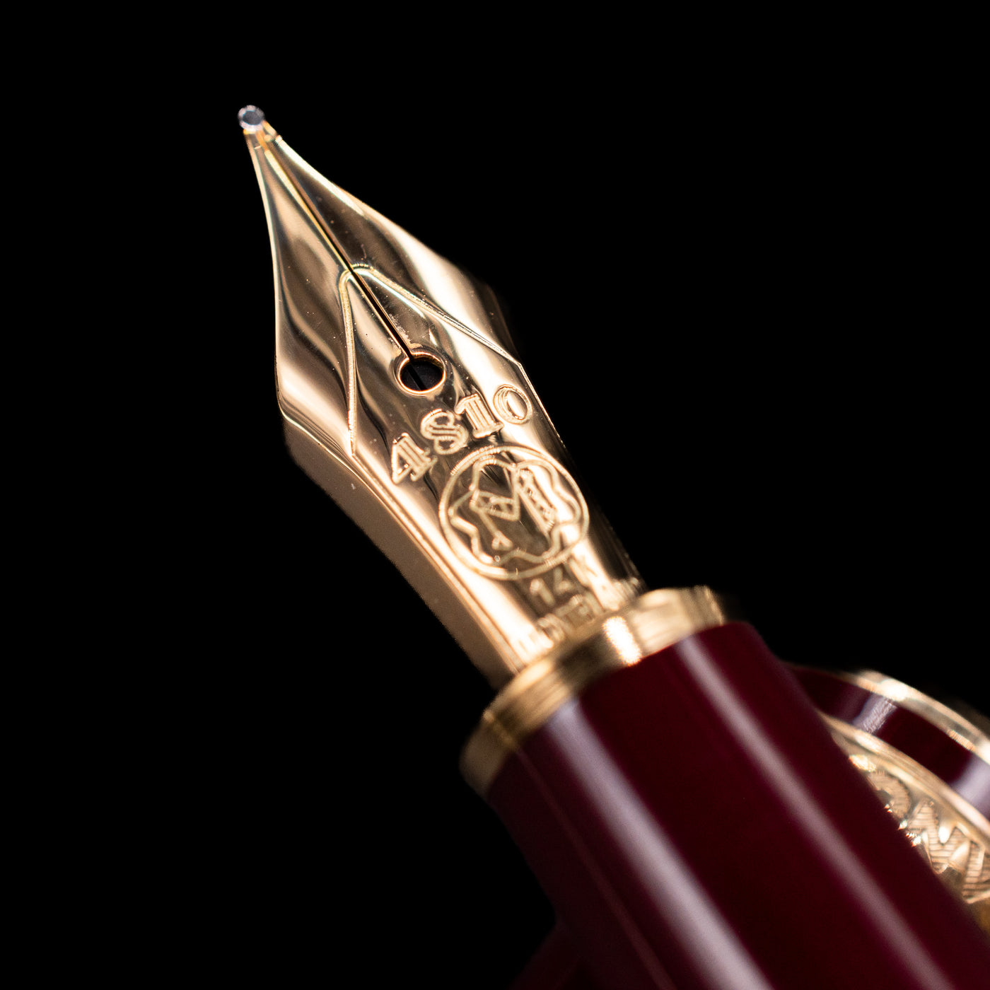 A macro shot of the nib with its intricate detailing and logo engraving for the Montblanc Meisterstuck 144R Bordeaux Fountain Pen - Preowned.