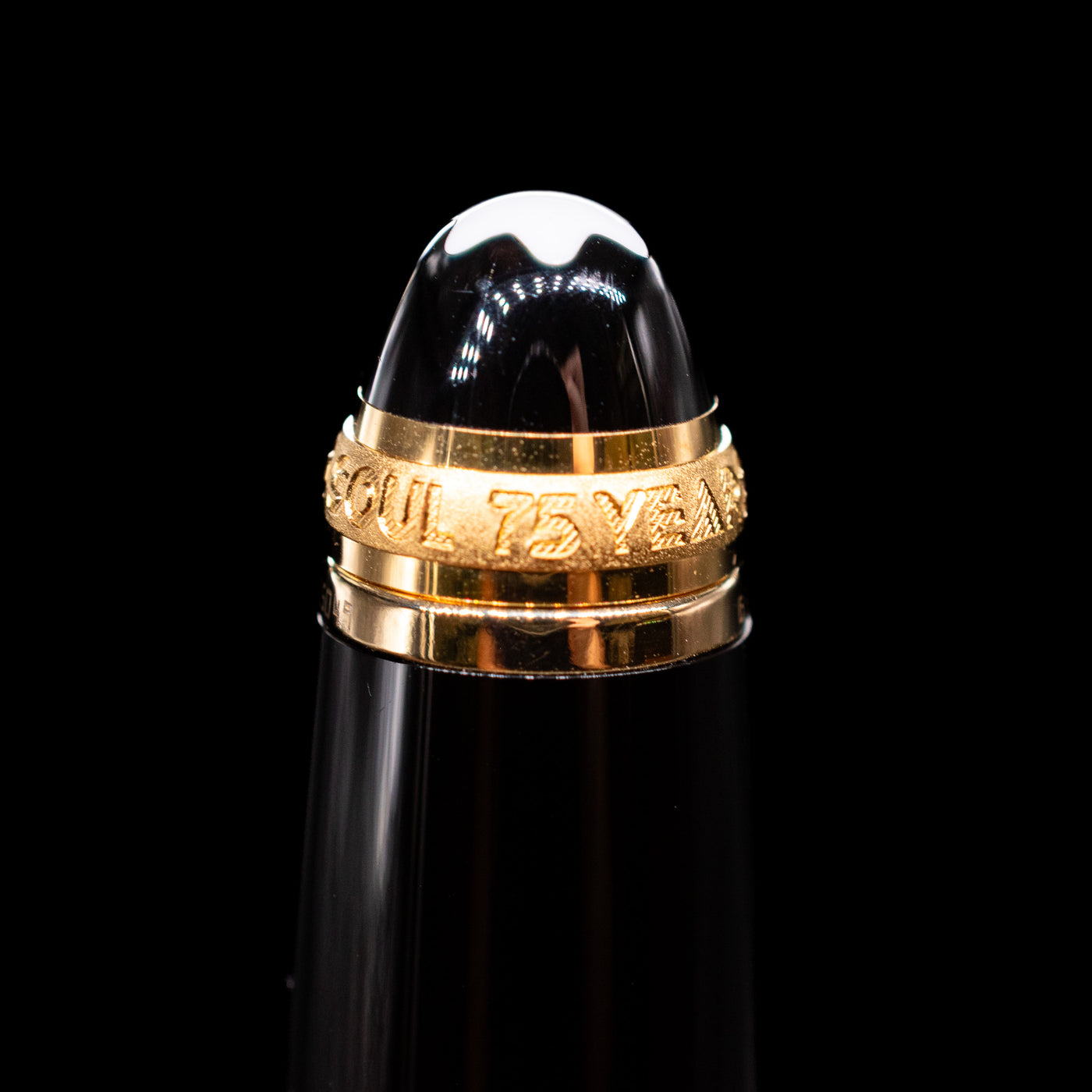A macro shot of the 75 years sign near the top of the cap on the Montblanc Meisterstuck 146 75th Anniversary Special Edition LeGrand Fountain Pen - Preowned.