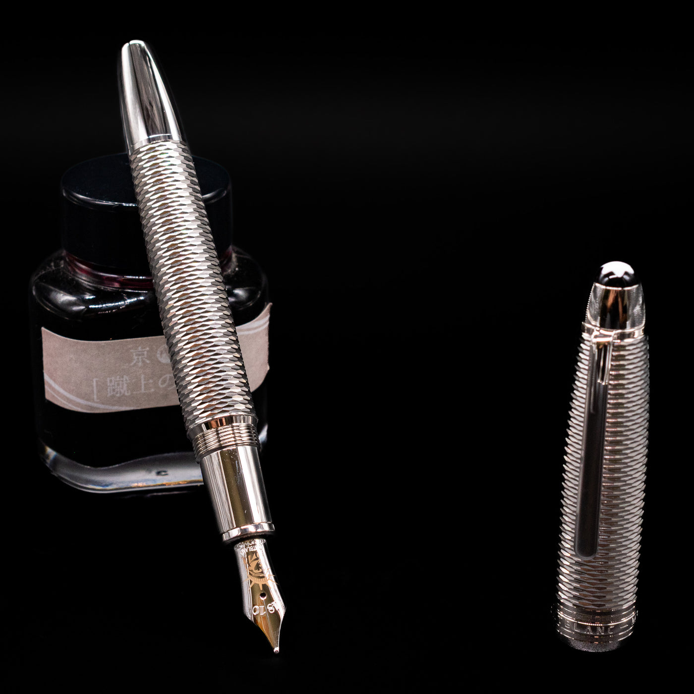 Montblanc Meisterstuck 146 Solitaire Geometry City Edition LeGrand Fountain Pen - New York leaning on an ink bottle uncapped showcasing the detailing on the nib.