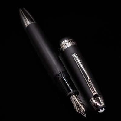  A full view of the Montblanc Meisterstuck 146 Ultra Black LeGrand Fountain Pen - Preowned uncapped, with its cap laying next to the pen. 