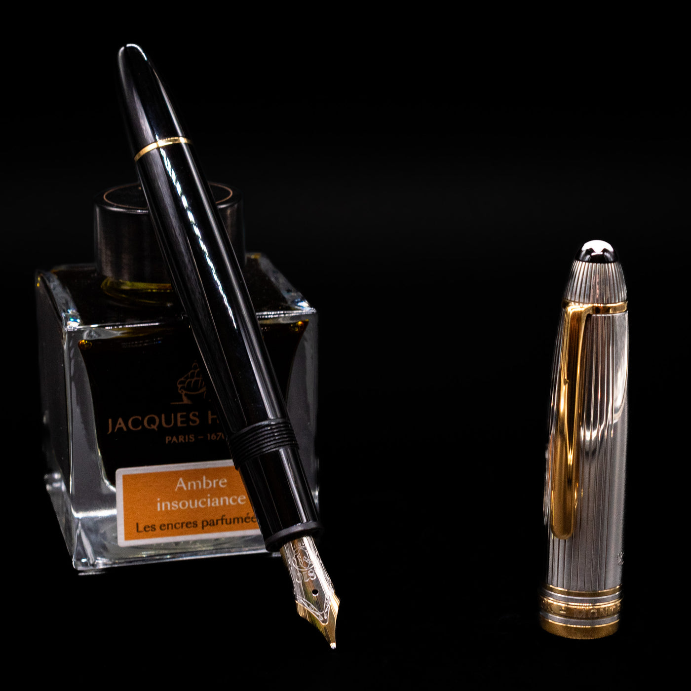 Montblanc Meisterstuck 147DS Solitaire Doue Traveler Fountain Pen - Preowned leaning on an ink bottle uncapped showcasing the detailing on the nib.