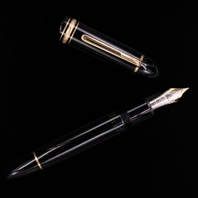 Overhead view of the preowned Montblanc Meisterstück 149 fountain pen, highlighting the iconic snowcap emblem, streamlined shape, and gold clip.