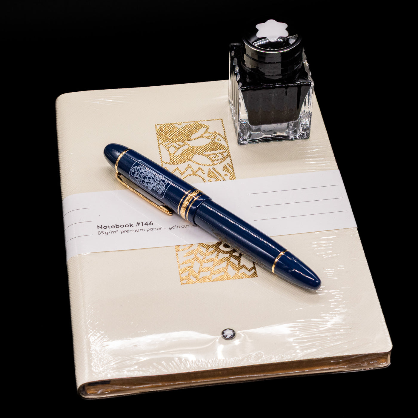 The items including in the Montblanc Meisterstuck 149 Orient Express Limited Edition 1883 Fountain Pen - Preowned box set, a fountain pen, an ink bottle and a notebook.