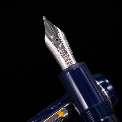 Close-up of the rhodium-coated 14k gold nib on the preowned Montblanc Meisterstück Le Petit Prince Fox LeGrand fountain pen, showcasing the intricate fox engraving and Montblanc detailing.