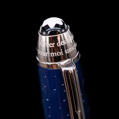 Close-up of the cap on the preowned Montblanc Meisterstück Le Petit Prince Fox LeGrand fountain pen, showing the engraved “Le Petit Prince” text and the platinum-plated clip with its fox emblem detail.