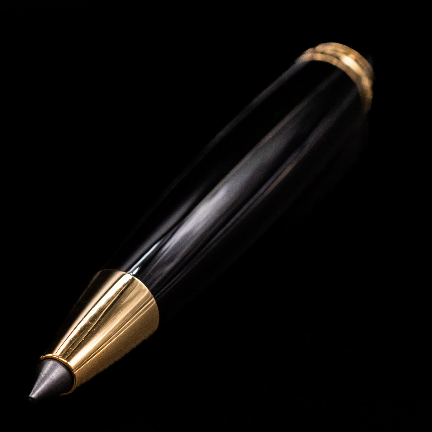 A full view of the Montblanc Meisterstuck Leonardo Black & Gold Sketch Pencil - Preowned activated with a focus on the tip.