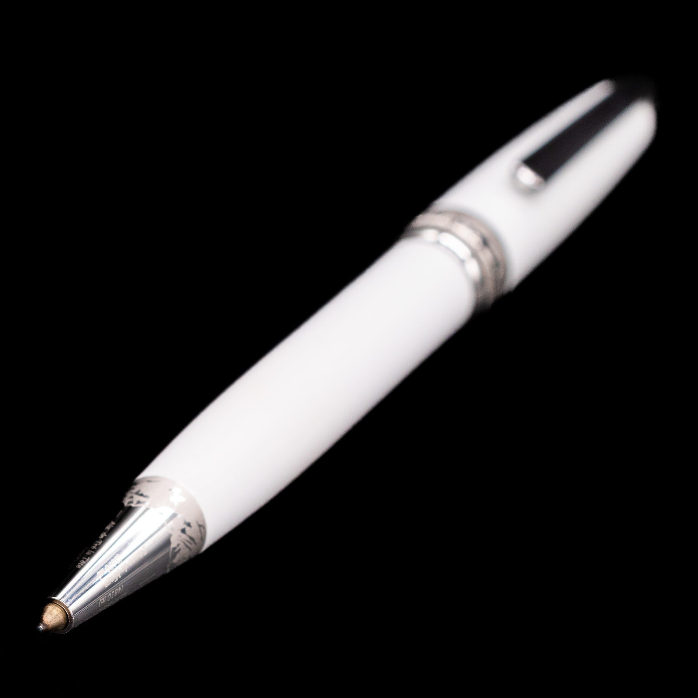 Full view of the preowned Montblanc Meisterstück Solitaire Tribute to Mont Blanc ballpoint pen with the tip extended, focusing closely on the platinum grip and writing point while showing the entire pen’s elegant silhouette.
