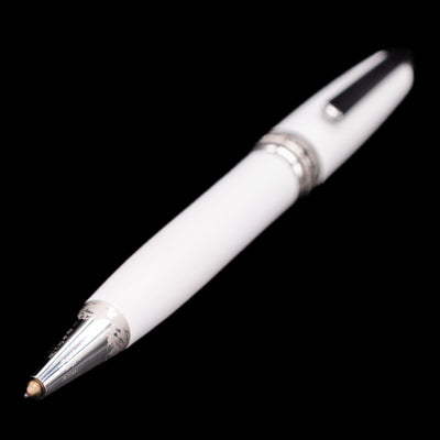 Full view of the preowned Montblanc Meisterstück Solitaire Tribute to Mont Blanc ballpoint pen with the tip extended, focusing closely on the platinum grip and writing point while showing the entire pen’s elegant silhouette.