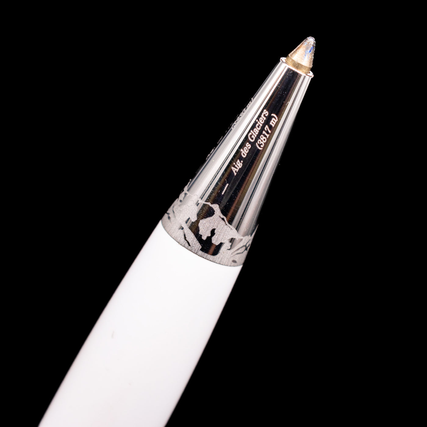 Close-up view of the extended ballpoint tip on the preowned Montblanc Meisterstück Solitaire Tribute to Mont Blanc, showing the precision writing point and platinum grip section.