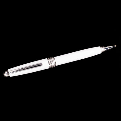 Overhead view of the preowned Montblanc Meisterstück Solitaire Tribute to Mont Blanc ballpoint pen, highlighting the streamlined design, white lacquer barrel, and platinum-plated clip.