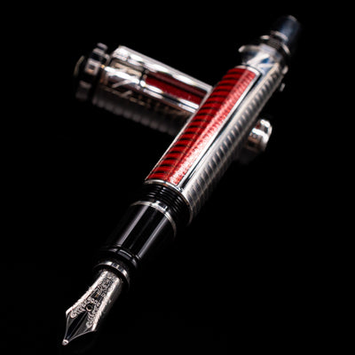Montblanc Patron of Art Sir Henry Tate 4810 Fountain Pen - Preowned laying across its own cap, crossed, with a focus on the nib.