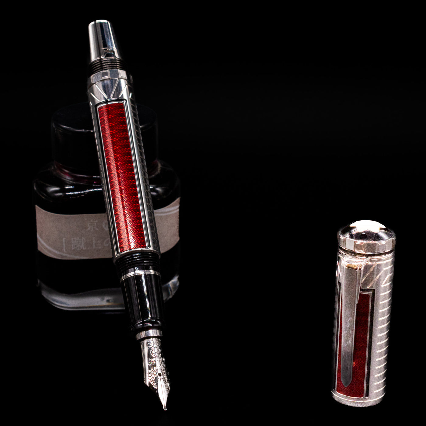 Montblanc Patron of Art Sir Henry Tate 4810 Fountain Pen - Preowned leaning on an ink bottle uncapped showcasing the detailing on the nib.