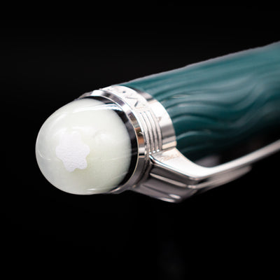 Zoomed-in view of the top of the cap with the iconic snowcap on the Montblanc Starwalker Resin Ballpoint Pen - Polar Green.