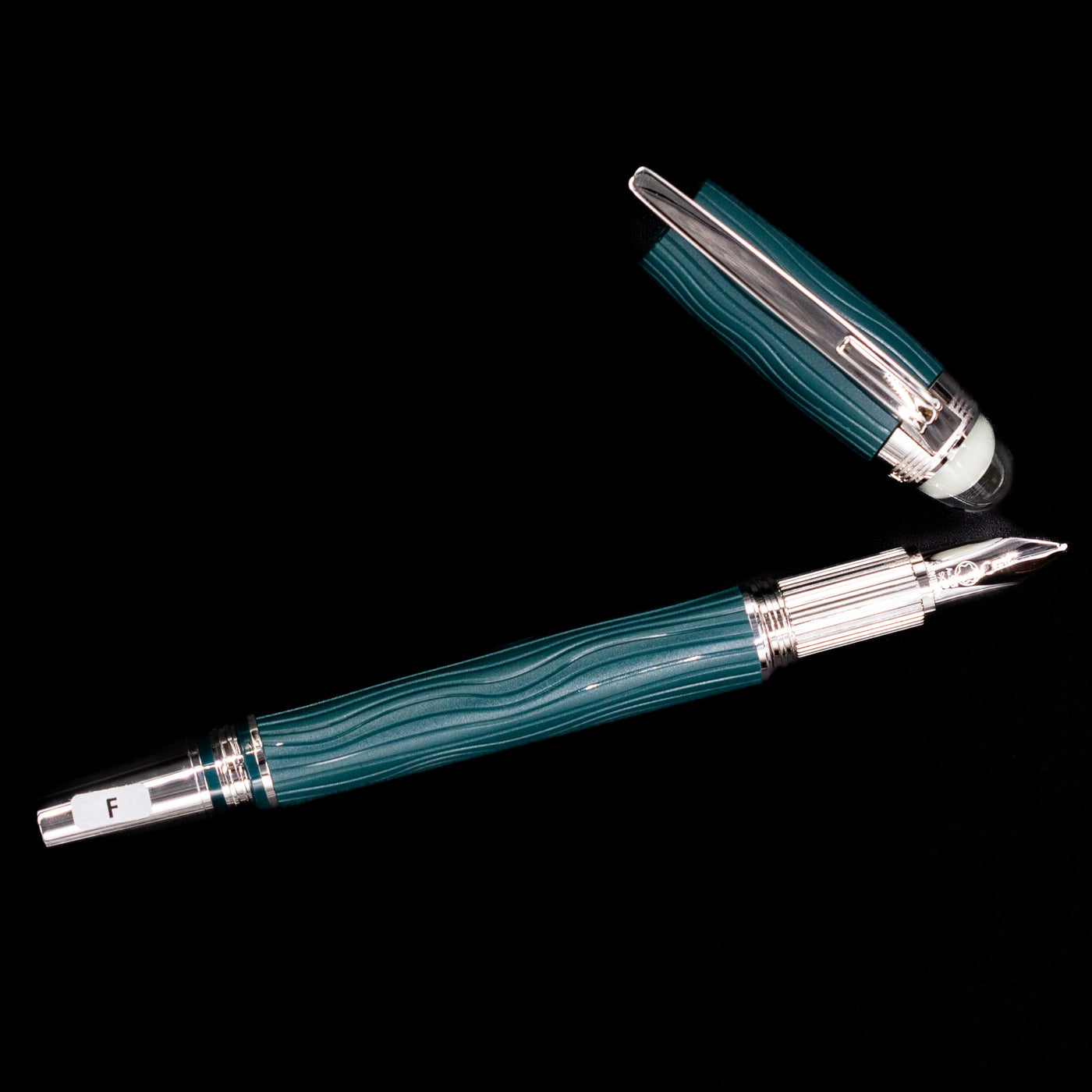 An overhead view of the Montblanc Starwalker Resin Fountain Pen - Polar Green uncapped. 