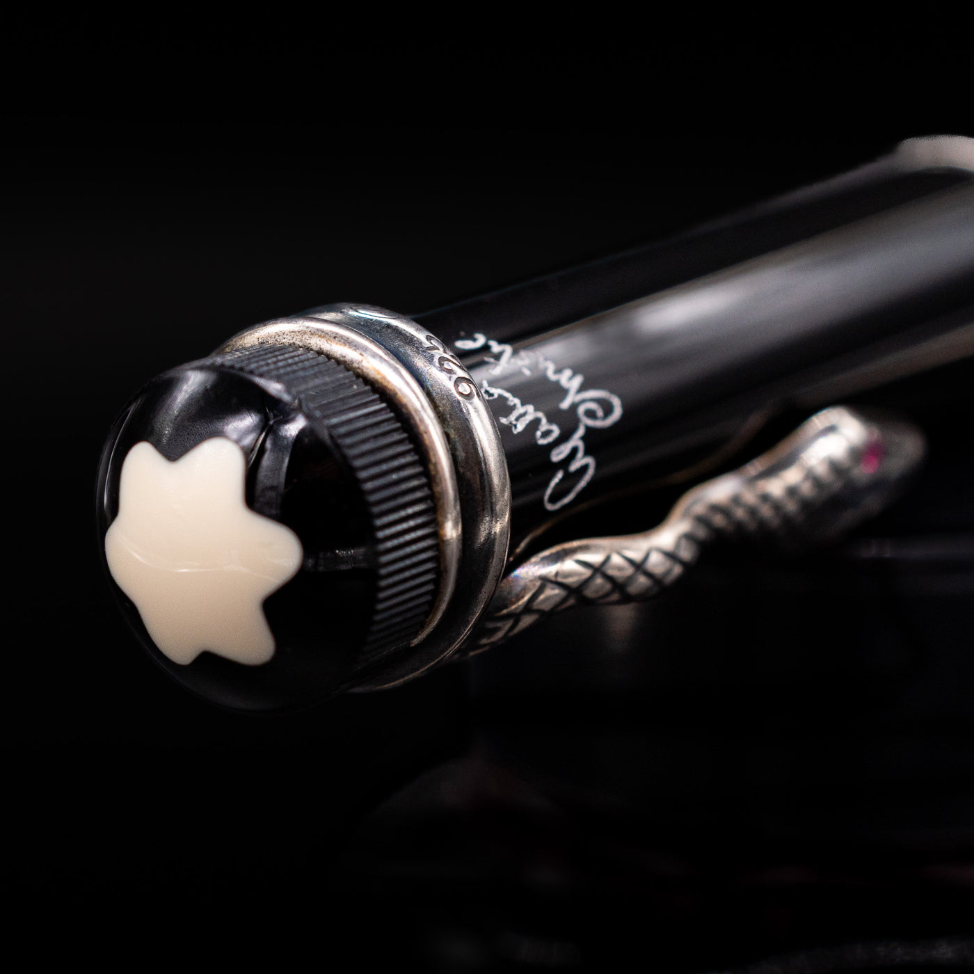 Zoomed-in view of the top of the cap with the finial on the Montblanc Writer's Edition Agatha Christie Ballpoint Pen - Preowned.