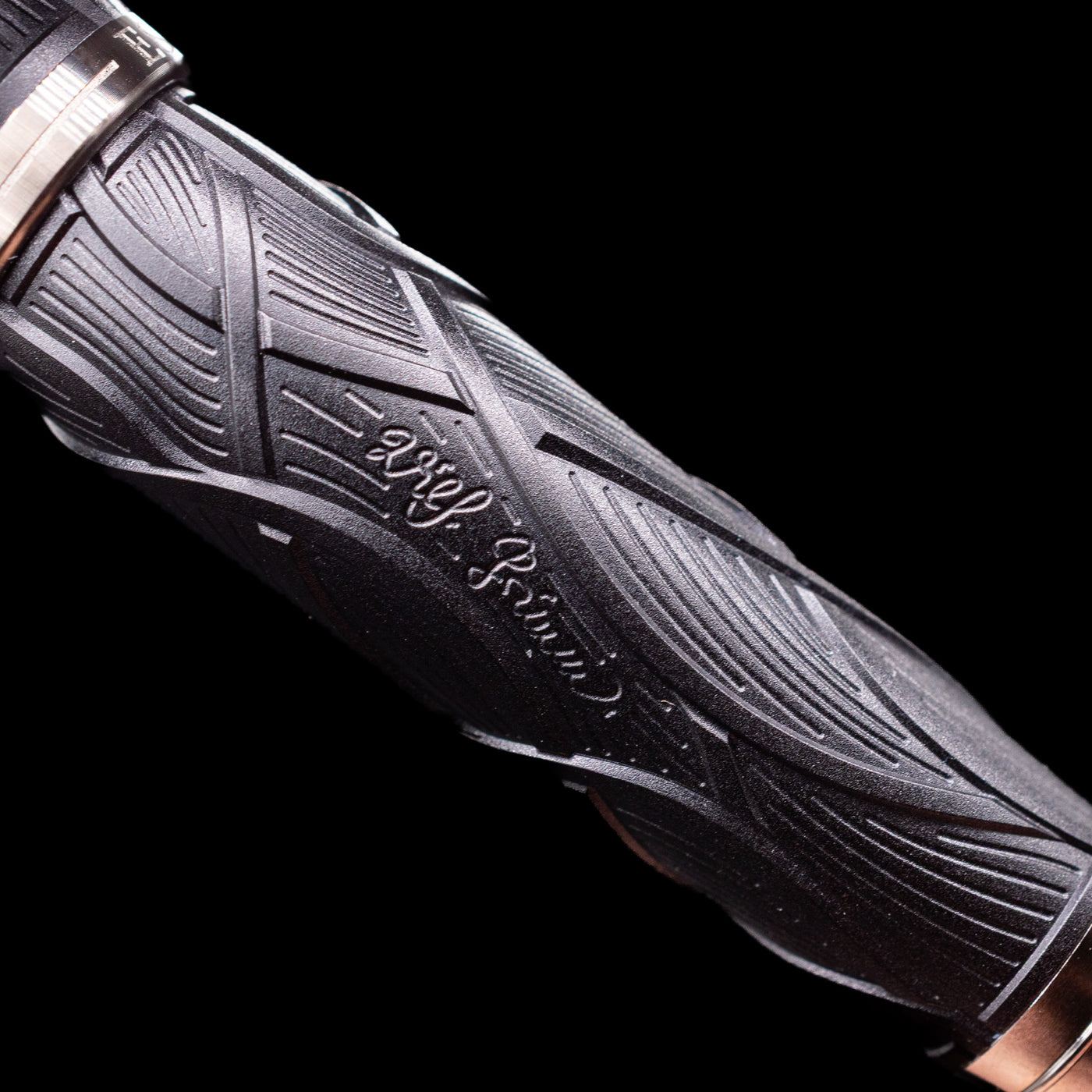 A zoomed-in shot of the writer's signature on the barrel on the Montblanc Writer's Edition Brothers Grimm Ballpoint Pen - Preowned.