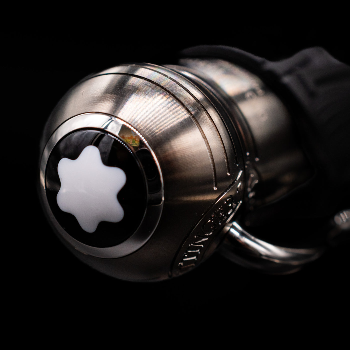 Zoomed-in view of the top of the cap with the finial on the Montblanc Writer's Edition Brothers Grimm Ballpoint Pen - Preowned.