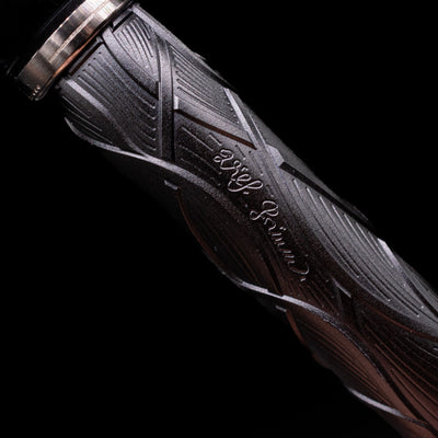 A macro shot of one of the brother's signatures on the body of the Montblanc Writer's Edition Brothers Grimm Fountain Pen.