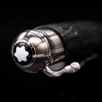 Zoomed-in view of the top of the cap with the finial on the Montblanc Writer's Edition Brothers Grimm Fountain Pen.