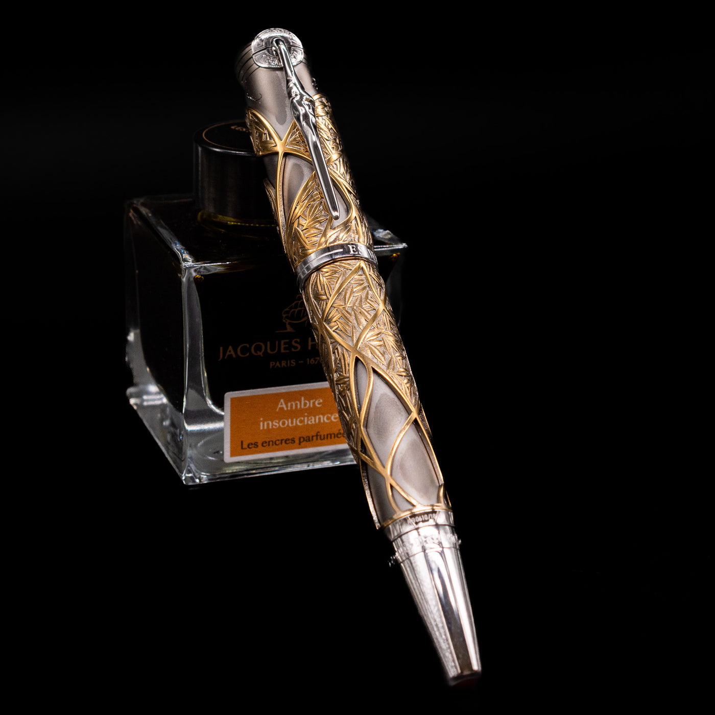 Montblanc Writer's Edition Brothers Grimm Limited Edition 1812 Rollerball Pen - Preowned capped, leaning against an ink bottle. 