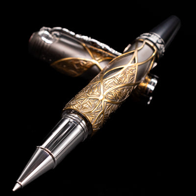 Montblanc Writer's Edition Brothers Grimm Limited Edition 1812 Rollerball Pen - Preowned laying across its own cap, crossed, with a focus on the tip.